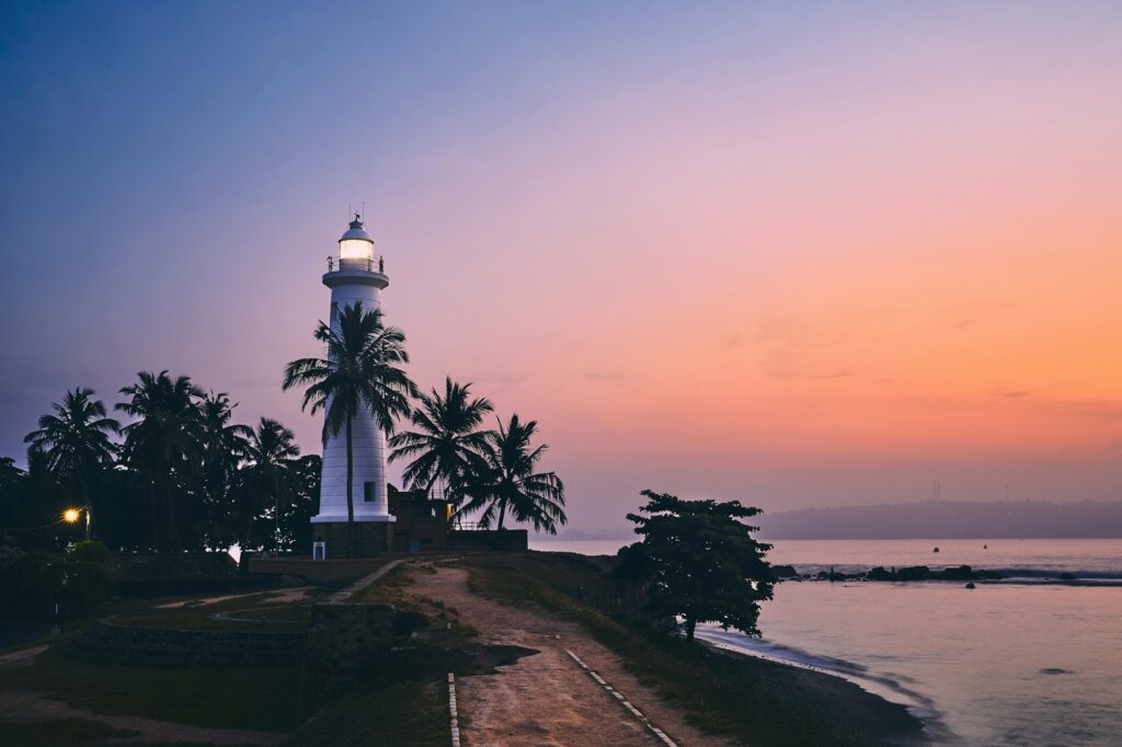 Lighthouse in fort in Galle. Old town in Sri Lanka at colorful sunrise.